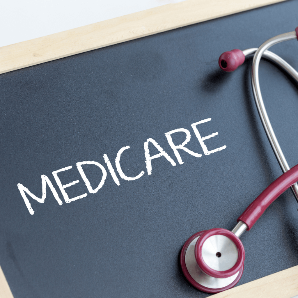 Blackboard with 'Medicare' written in white chalk, alongside a stethoscope, symbolizing informed healthcare planning with Senior Benefit Services.